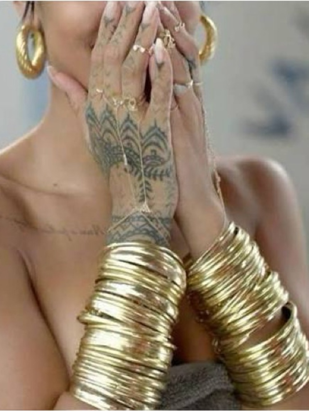 Stack of Gold Tone Bangles